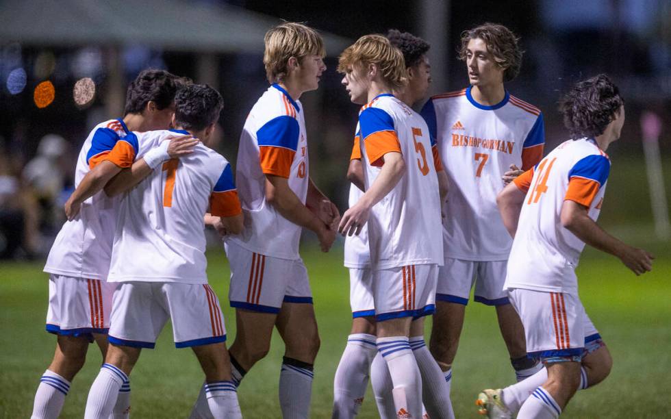 Bishop Gorman's Nicholas Lazarski (1) is congratulated on a goal over Cimarron during the first ...