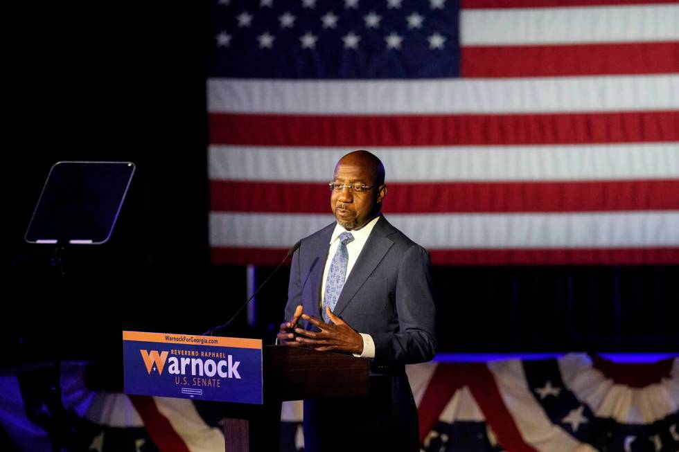 Democratic nominee for U.S Senate Sen. Raphael Warnock speaks during an election-night watch pa ...