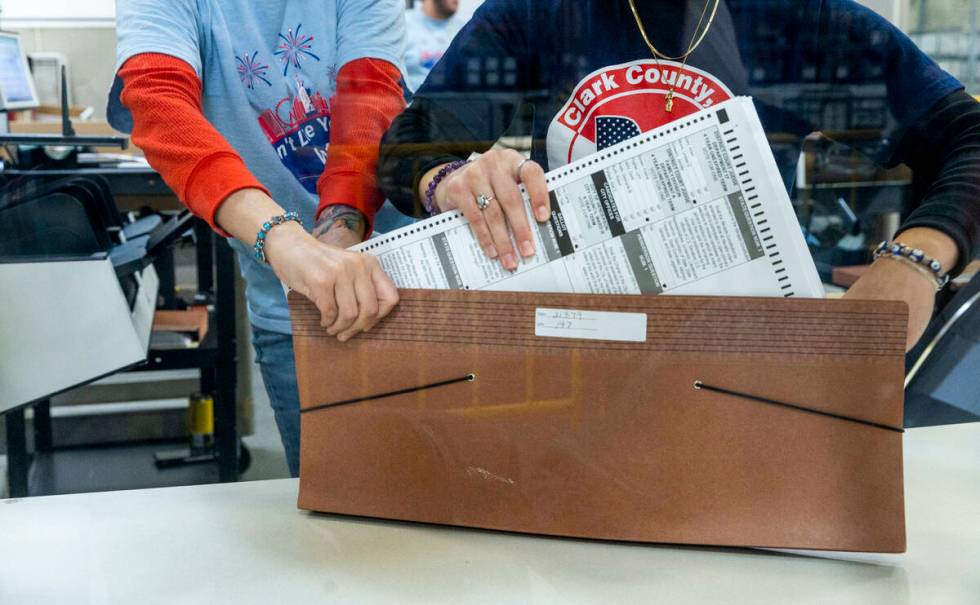 Workers bundle ballots as sorting continues for final tabulations at the Clark County Election ...