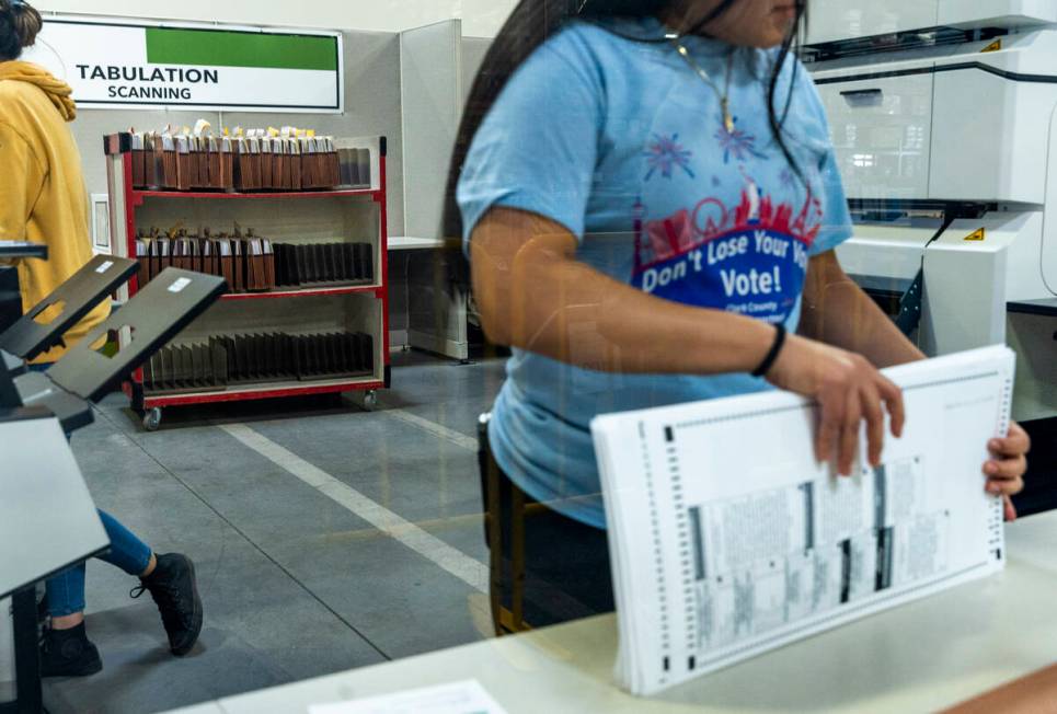 A worker continues sorting ballots for final tabulations at the Clark County Election Departmen ...