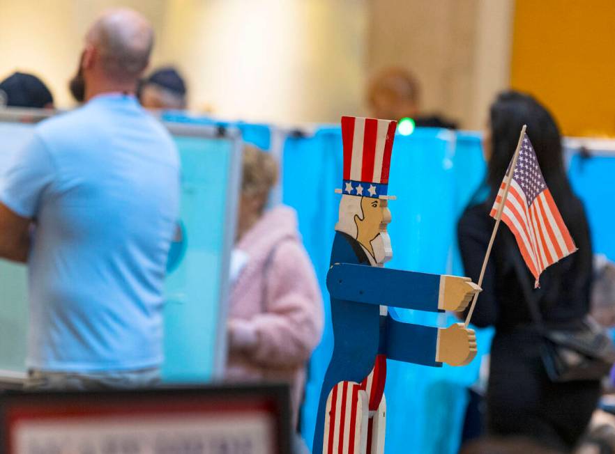 Voters line up to cast their vote at Galleria at Sunset, on Tuesday, Nov. 8, 2022, in Henderson ...