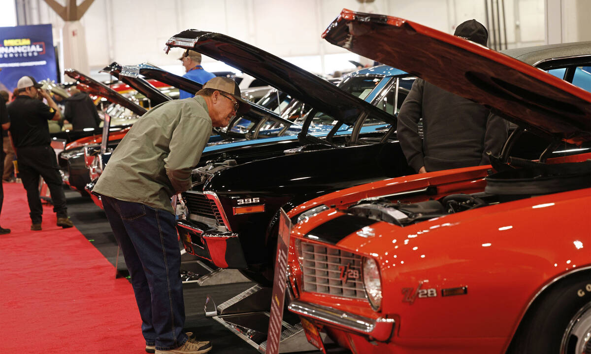 John Reinbolz of Beaumont Calif. checks out cars during Mecum Las Vegas auction at the Las Vega ...