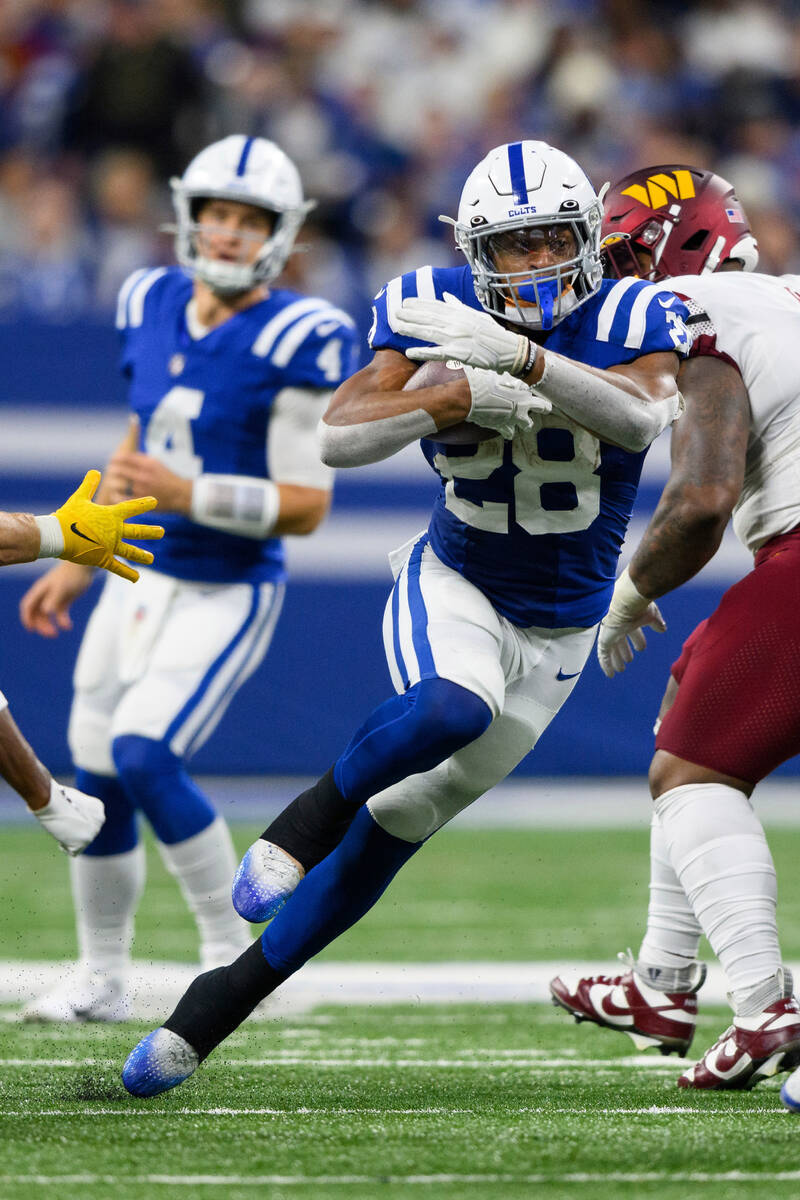 Indianapolis Colts running back Jonathan Taylor (28) runs up the middle during an NFL football ...