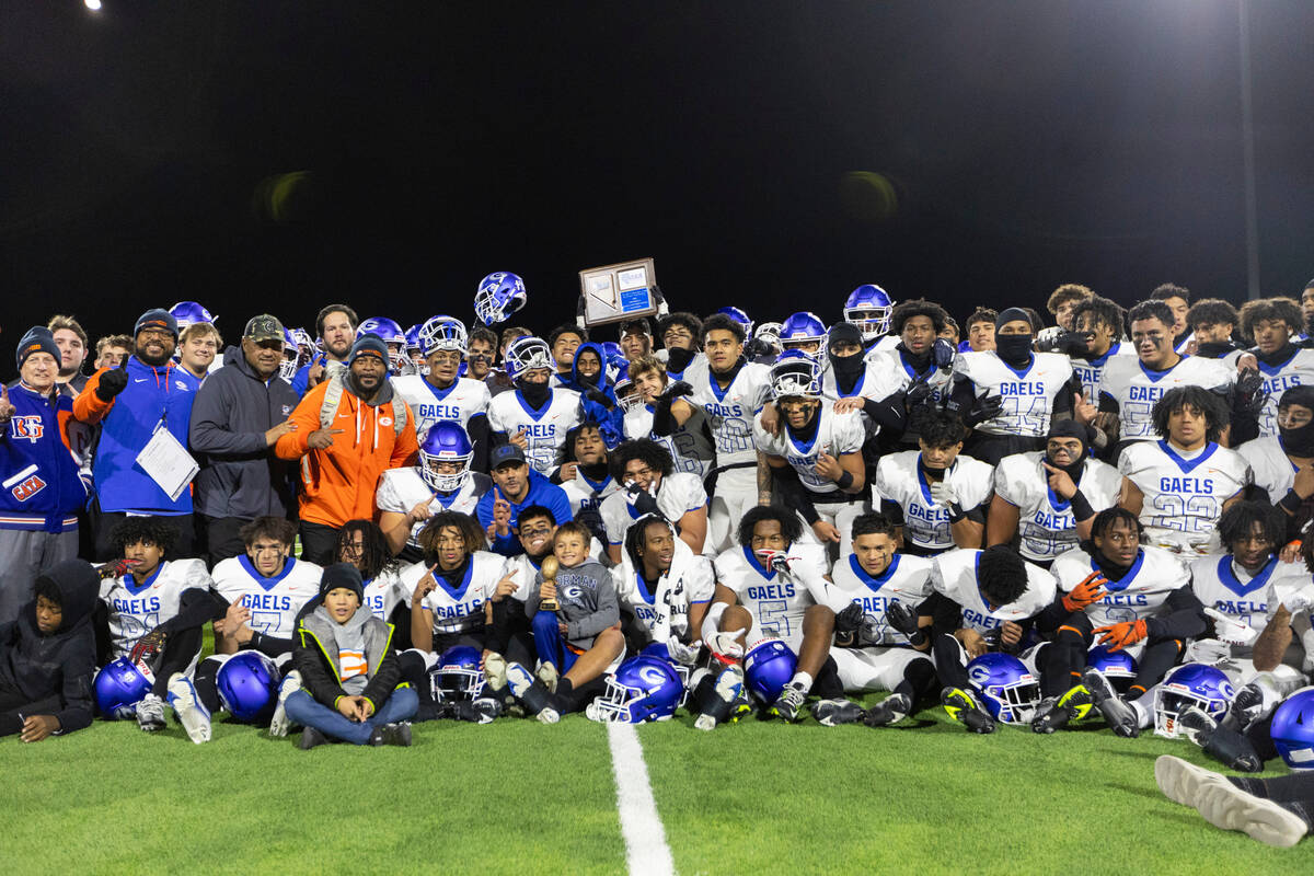 Bishop Gorman poses for team photos after a win in a football 5A regional final against Liberty ...