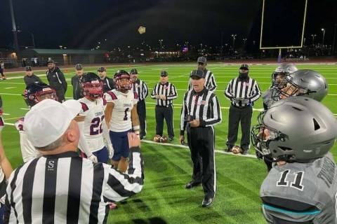 Referee John Hathaway flips the coin before the start of Friday night's Silverado vs. Coronado ...