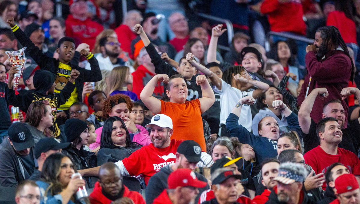 UNLV Rebels fans compete on the "flex cam" facing the Fresno State Bulldogs during th ...