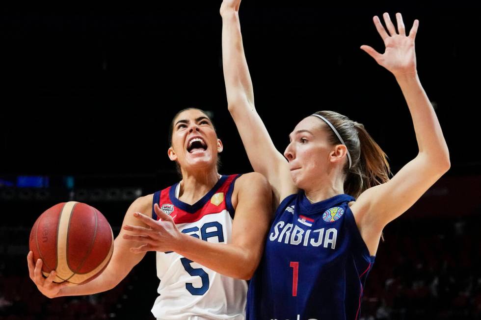 United States' Kelsey Plum runs past Serbia's Ivana Raca during their quarterfinal game at the ...