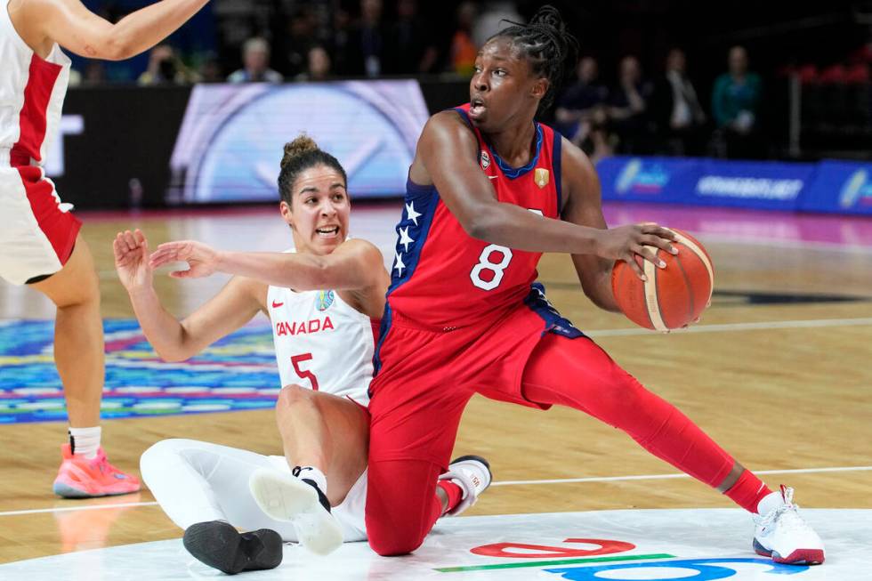 Canada's Kia Nurse, left, and United States' Chelsea Gray scramble for the ball during their se ...