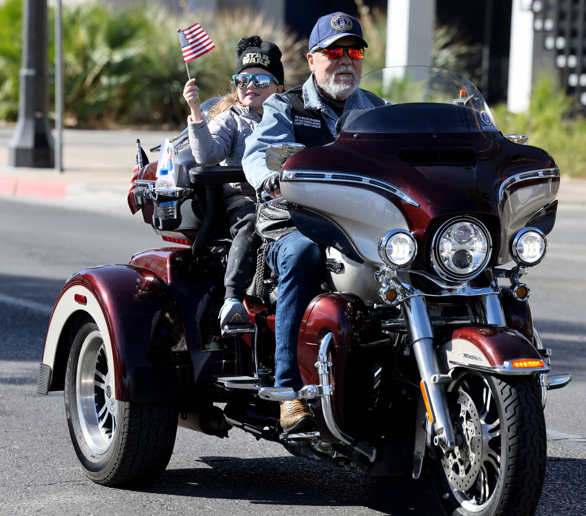 Ron Turouske and his granddaughter Zoe Wild ride in the Veterans Day parade on Fourth Street in ...