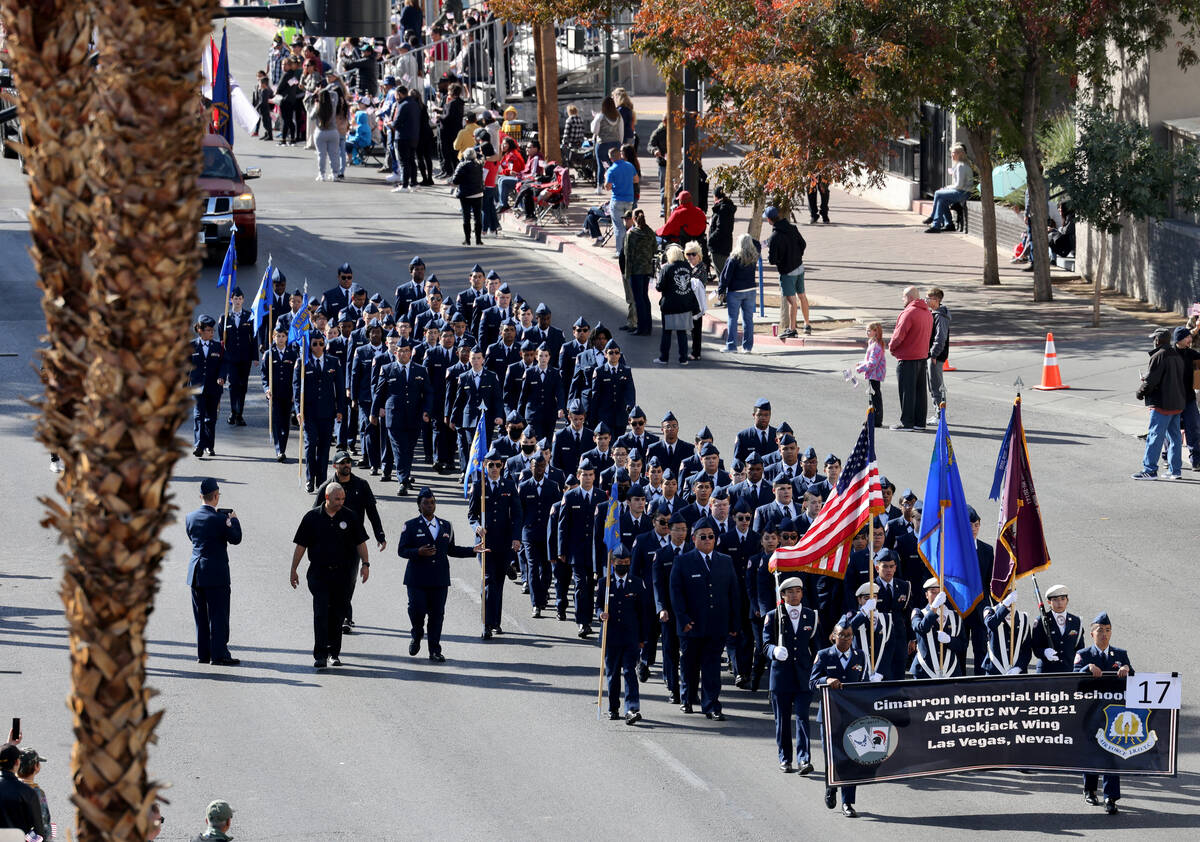 Members of the Cimarron Memorial High School Air Force Junior ROTC march in the Veterans Day pa ...