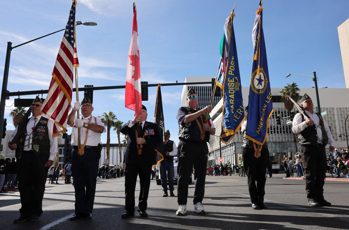 American Legion Paradise Post 149 members march in the Veterans Day parade on Fourth Street in ...