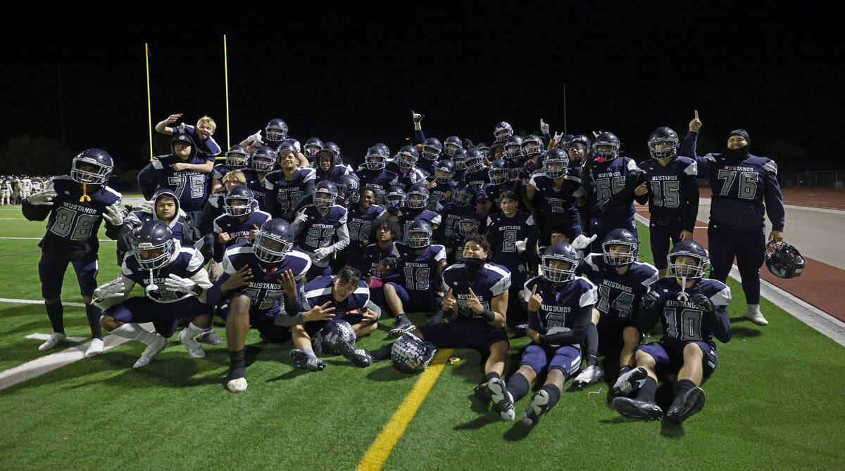 Shadow Ridge players pose for a photo after their victory against Las Vegas High School at a 4A ...