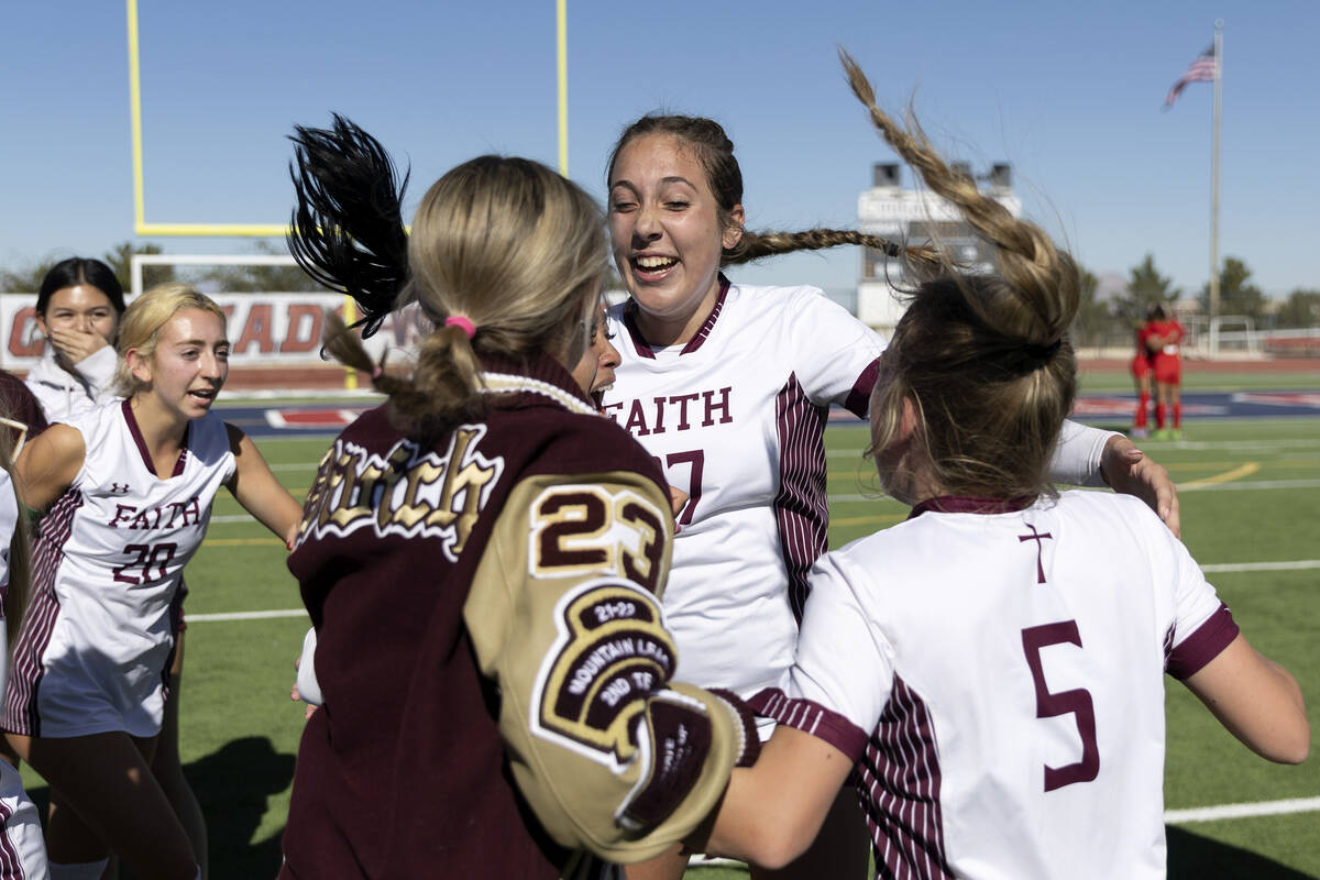 Faith Lutheran players including Madeline Mariani, center, and McKenna Beckett (5) celebrate af ...