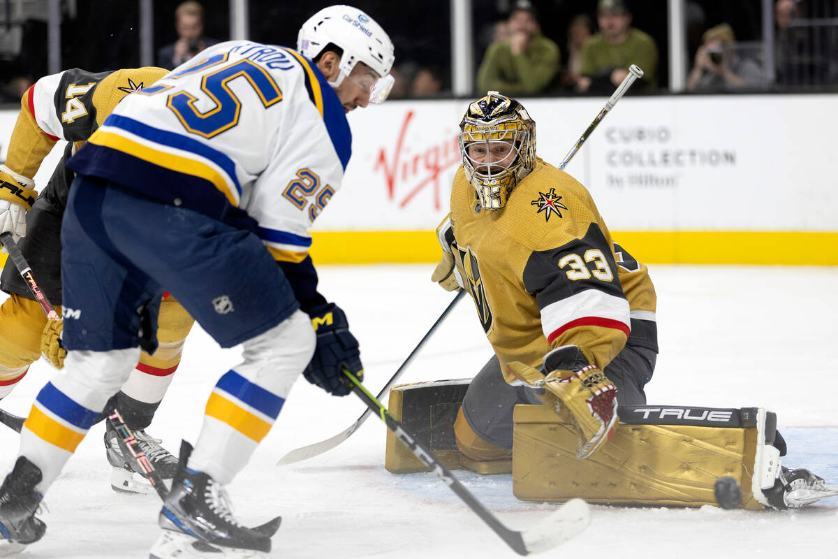 Vegas Golden Knights goaltender Adin Hill (33) makes a save against St. Louis Blues center Jord ...