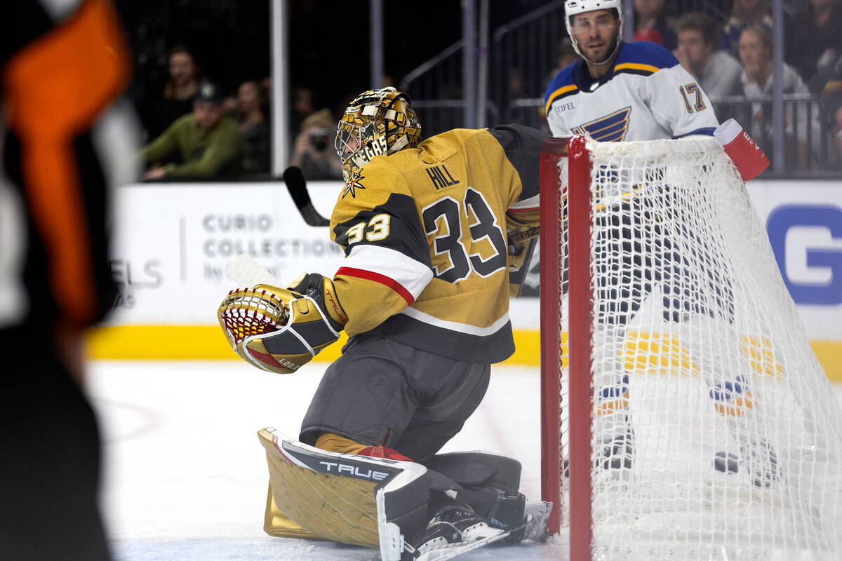 Vegas Golden Knights goaltender Adin Hill (33) misses a save on a goal shot by St. Louis Blues ...