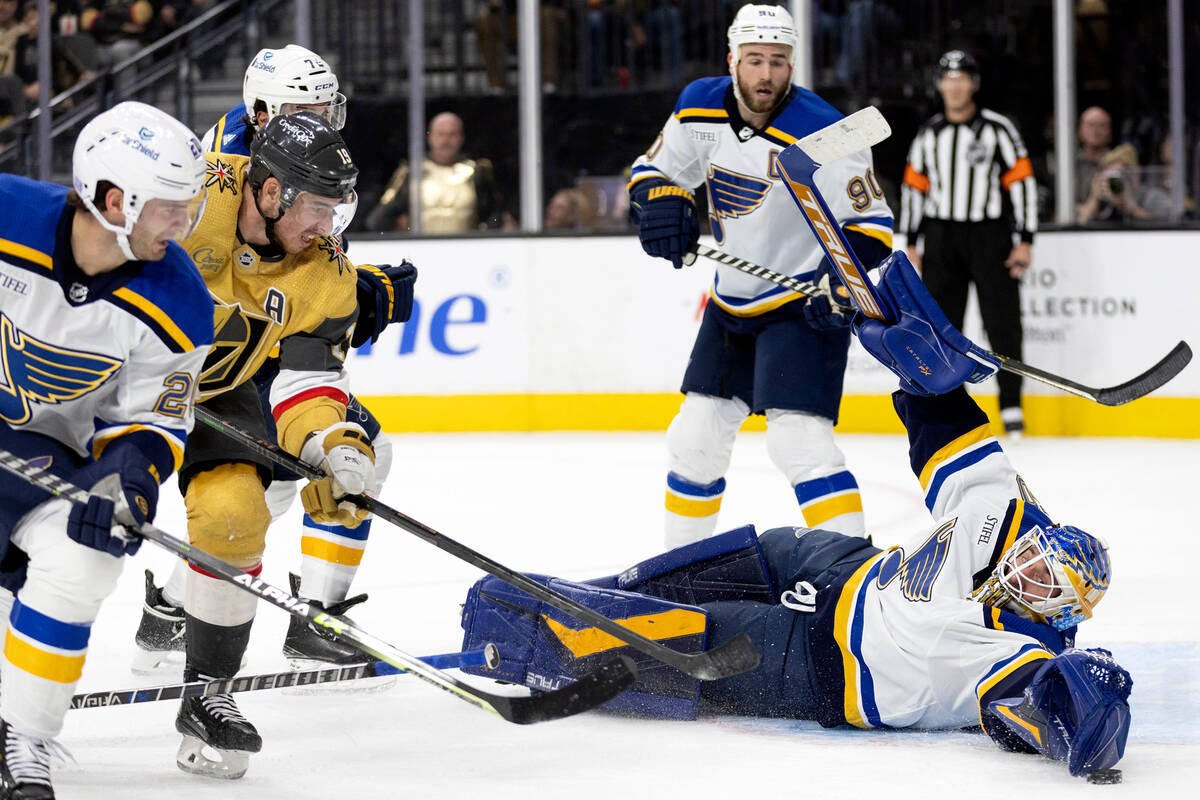 St. Louis Blues goaltender Jordan Binnington dives to make the save on a shot by Vegas Golden K ...