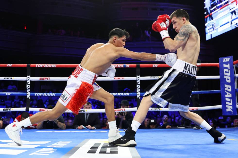 Emiliano Fernando Vargas, left, connects a punch against Julio Cesar Martinez in the first roun ...