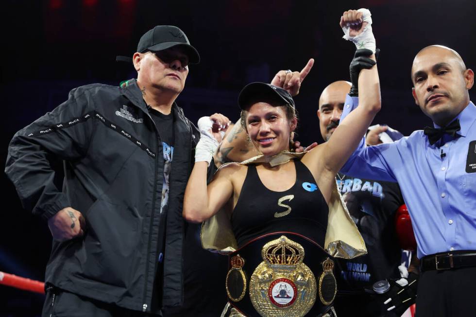 Seniesa Estrada, center, poses after her unanimous decision win against Jazmin Gala Villarino i ...