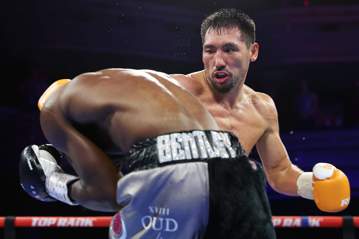 Janibek Alimkhanuly, right, battles Denzel Bentley in the fifth round of a WBO middleweight tit ...