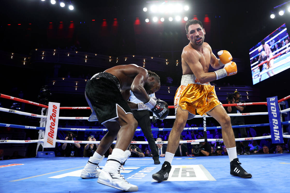 Denzel Bentley, left, dodges a punch from Janibek Alimkhanuly in the 12th round of a WBO middle ...