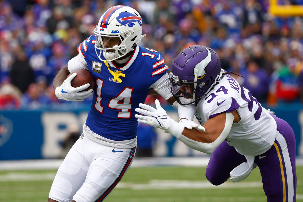 Buffalo Bills wide receiver Stefon Diggs (14) is brought down by Minnesota Vikings linebacker E ...