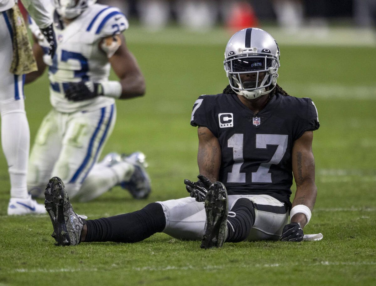 Raiders wide receiver Davante Adams (17) remains on the field sitting after a play break up by ...