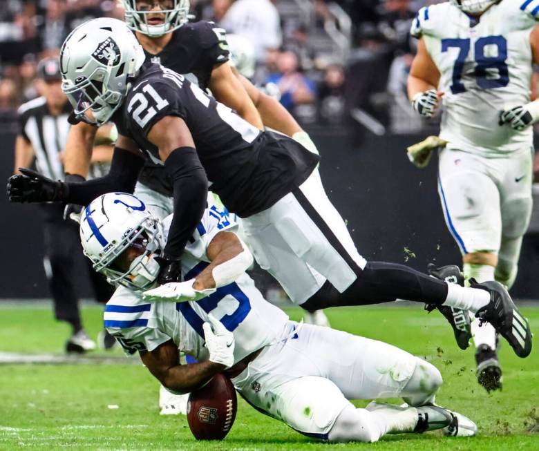 Raiders cornerback Amik Robertson (21) forces Indianapolis Colts wide receiver Keke Coutee (15) ...