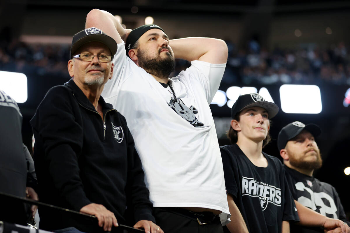 Fans react after the Raiders failed attempt to score in their last drive of the second half of ...