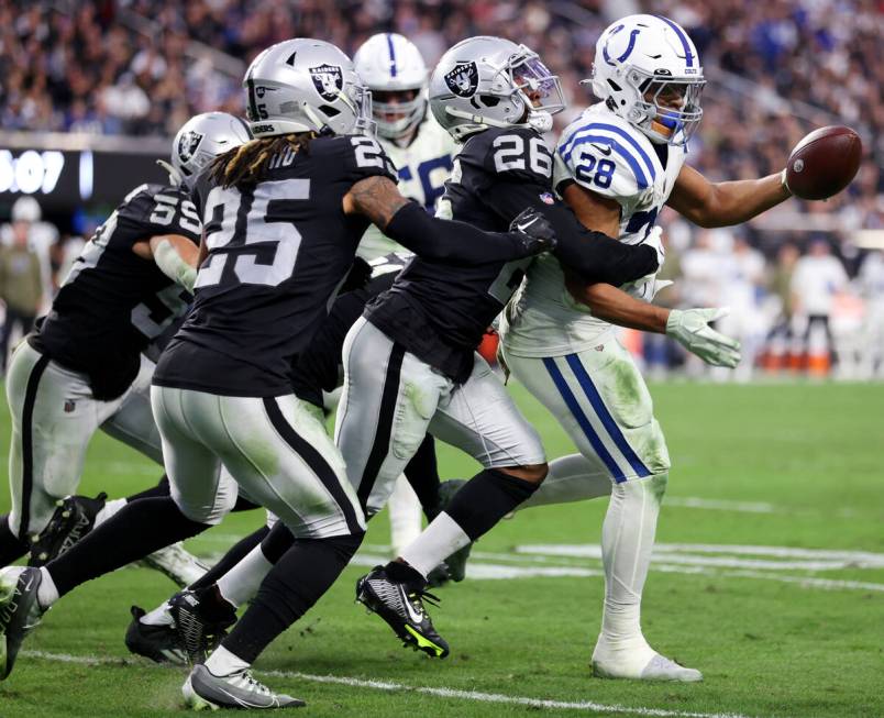 Raiders cornerback Rock Ya-Sin (26) tackles Indianapolis Colts running back Jonathan Taylor (28 ...