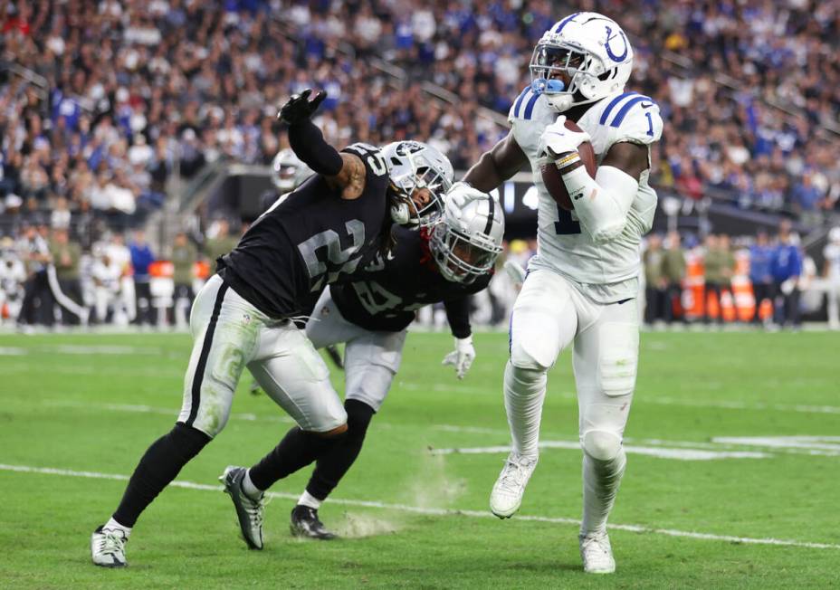 Indianapolis Colts wide receiver Parris Campbell (1) runs past Raiders safety Tre'von Moehrig ( ...