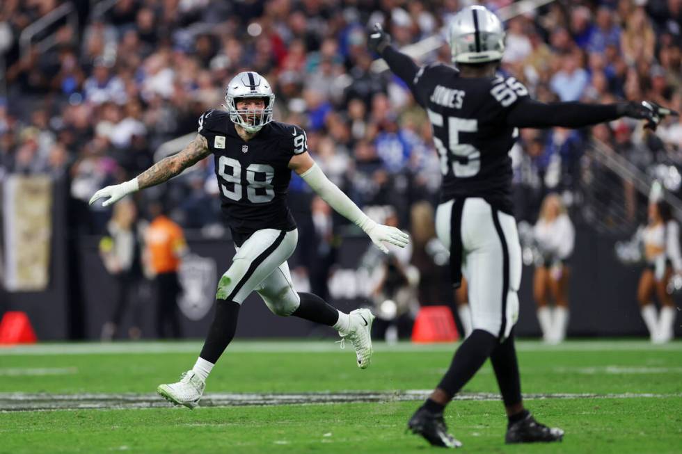 Raiders defensive end Maxx Crosby (98) reacts after getting a sack against Indianapolis Colts q ...