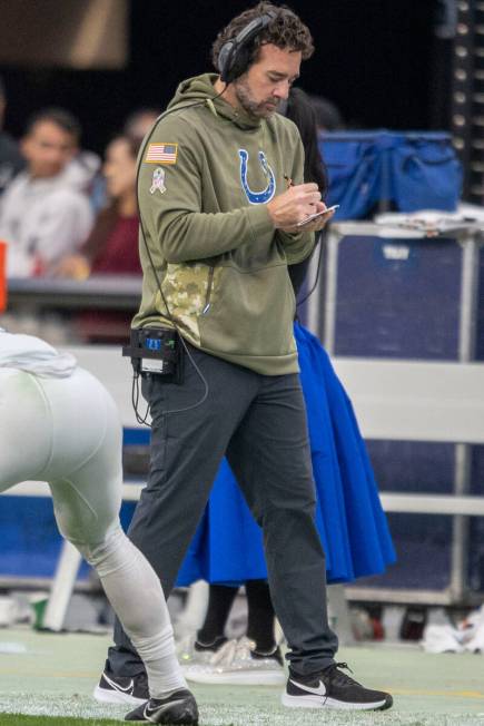 Indianapolis Colts head coach Jeff Saturday marks down notes during the first half of an NFL ga ...