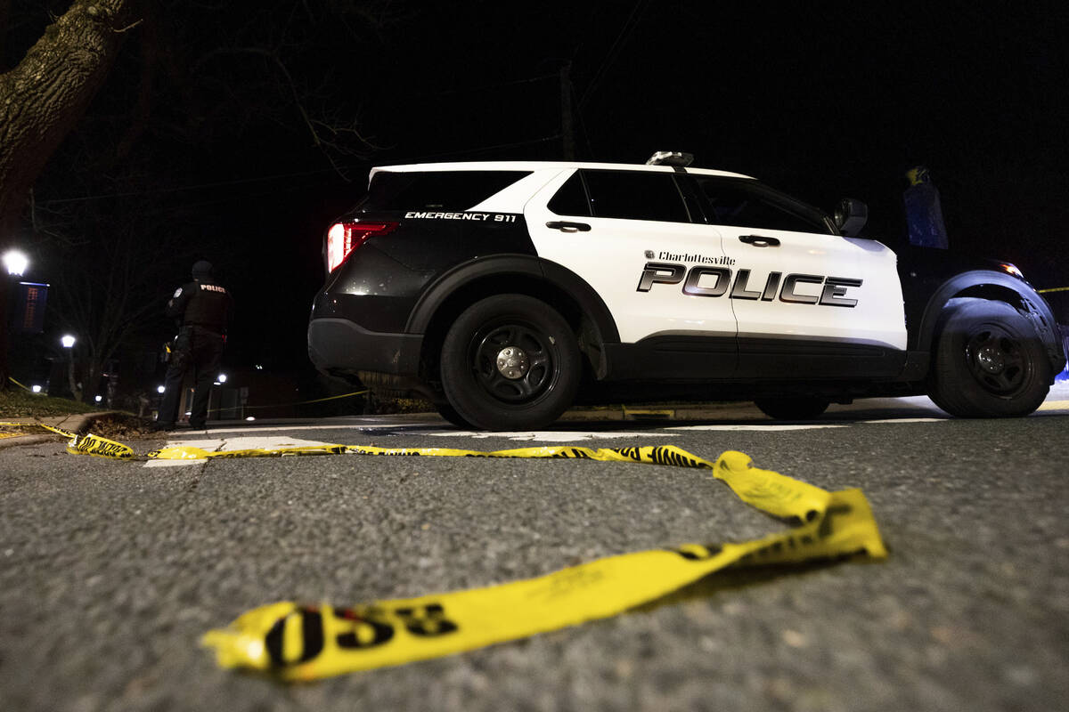 A Charlottesville Police vehicle is parked on Culbreath Road during an active shooter situation ...