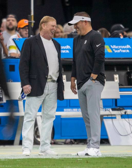 Raiders owner Mark Davis, left, and head coach Josh McDaniels share moment before an NFL game a ...