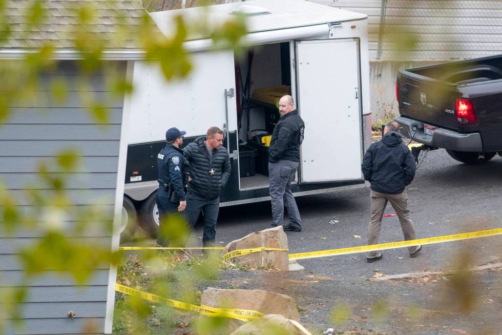 Officers investigate a homicide at an apartment complex south of the University of Idaho campus ...