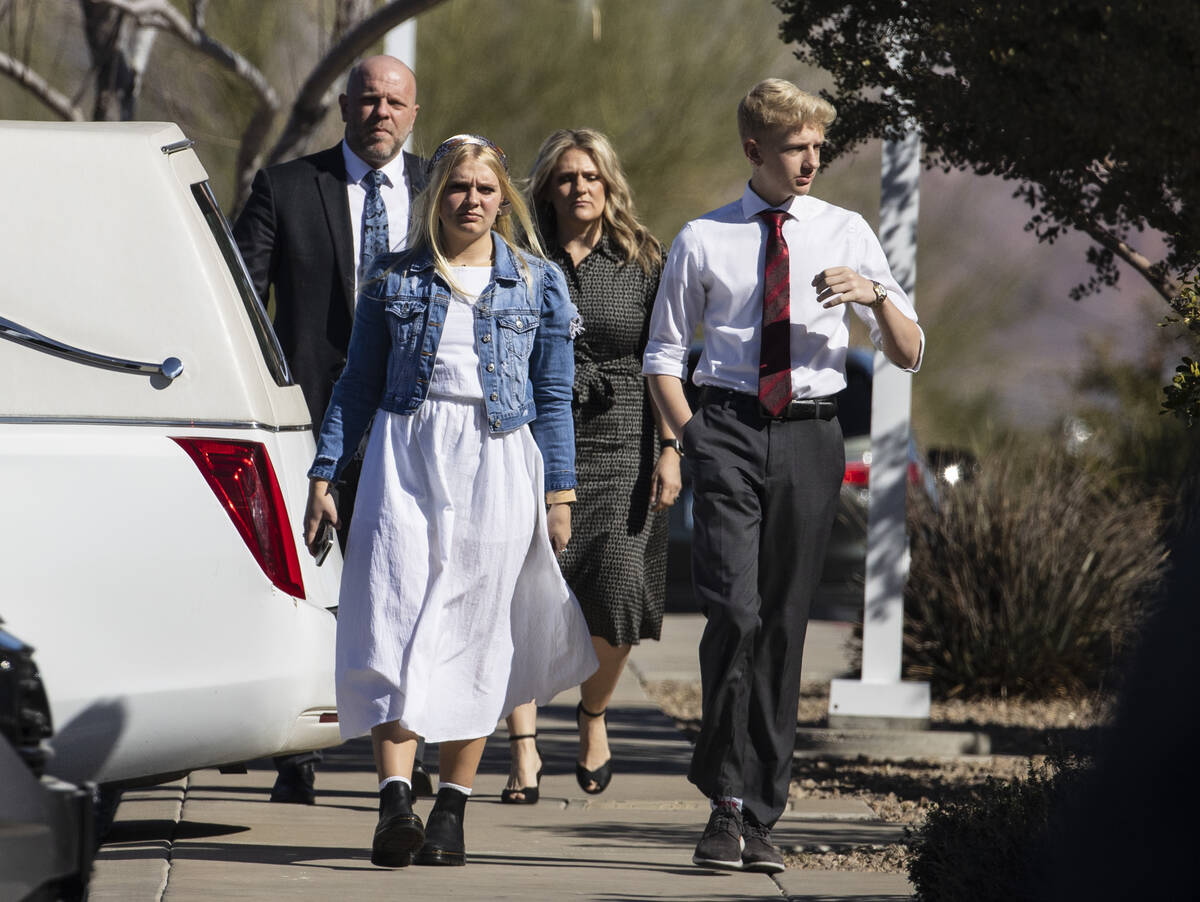 Mourners arrive at the Church of Jesus Christ of Latter-day Saints to attend Rex Patchett&#x201 ...