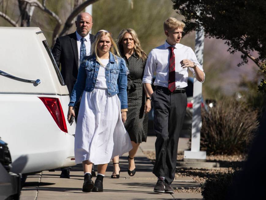 Mourners arrive at the Church of Jesus Christ of Latter-day Saints to attend Rex Patchett&#x201 ...