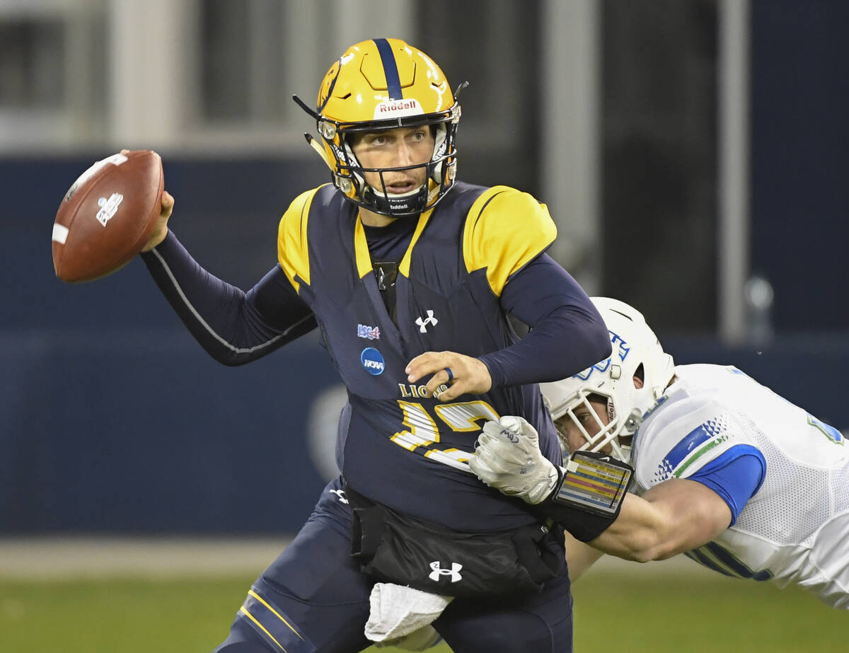 Texas A&M-Commerce Lions quarterback Luis Perez (12) is pressured by West Florida Argonauts ...