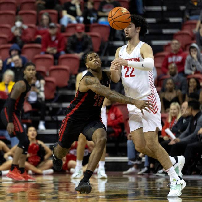 UNLV Rebels guard Luis Rodriguez (15) steals the ball from Dayton Flyers forward Mustapha Amzil ...