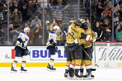 The Vegas Golden Knights celebrate after right wing Reilly Smith (19) scored a goal during the ...