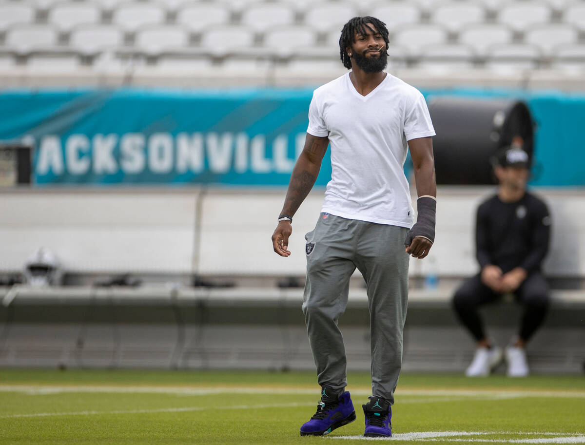 Raiders cornerback Nate Hobbs walks the field before an NFL game against the Jacksonville Jagua ...