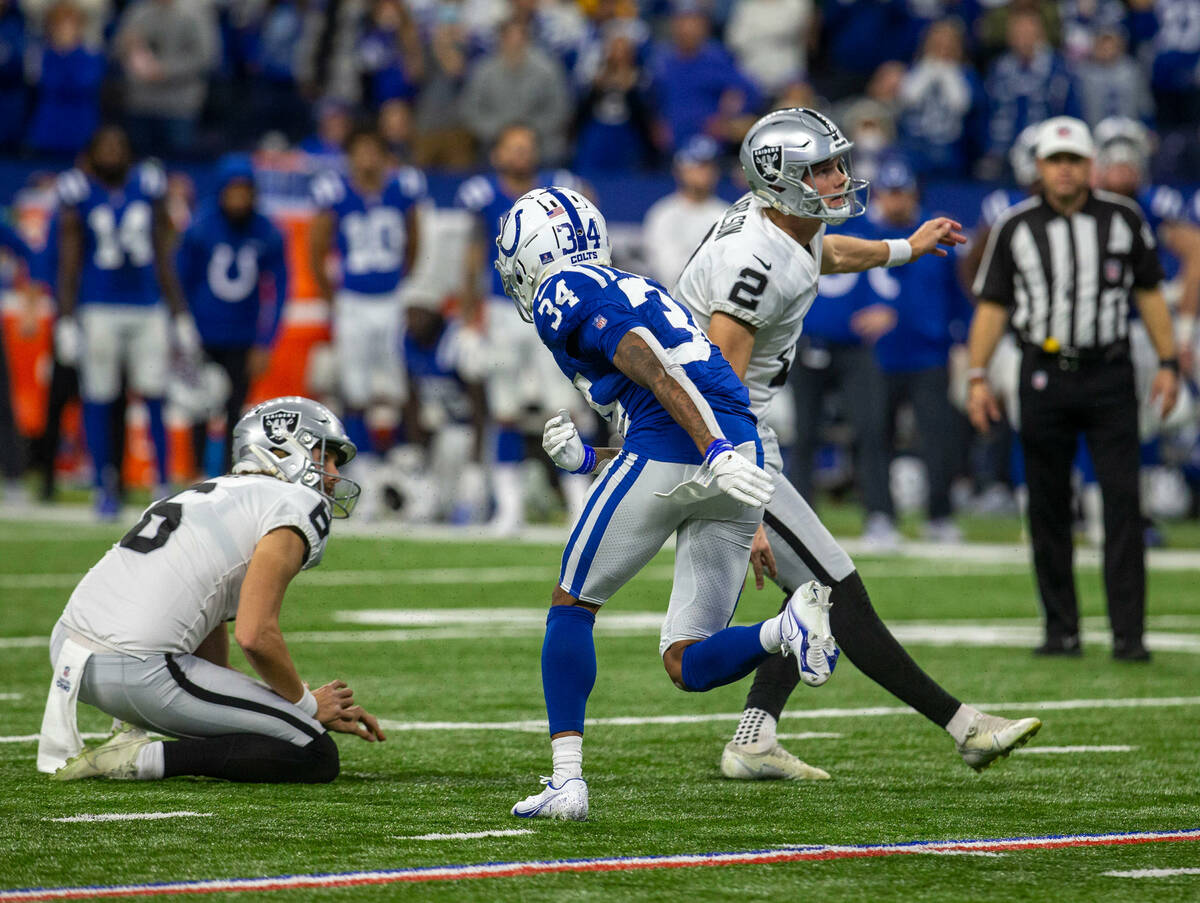 Raiders kicker Daniel Carlson (2) converts the game-winning field goal as Raiders punter A.J. C ...