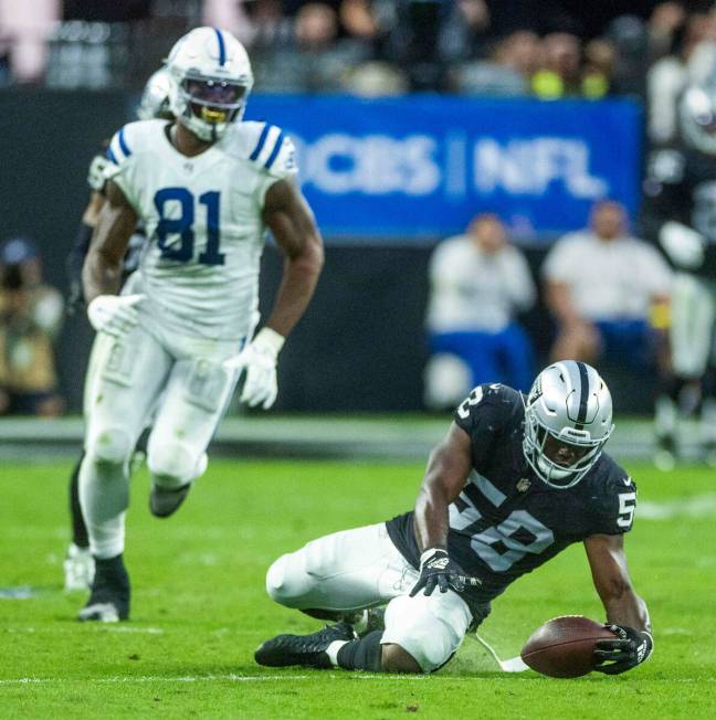 Raiders linebacker Darien Butler (58) attempts to recover a fumble as Indianapolis Colts tight ...