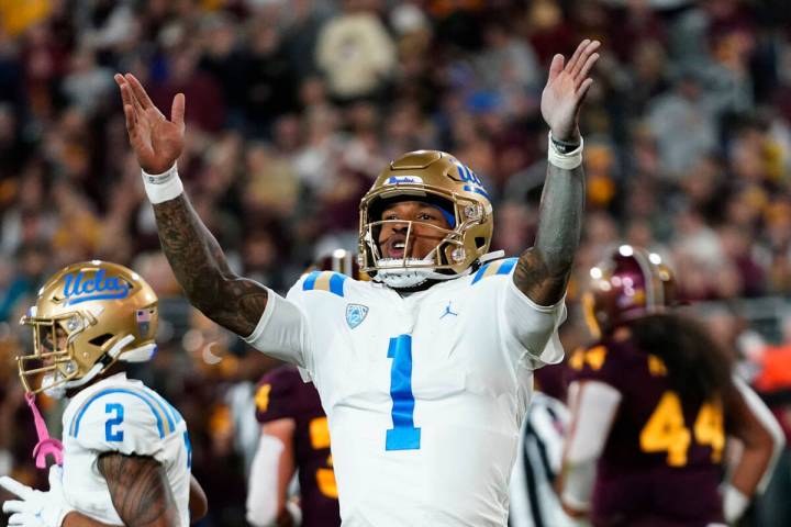 UCLA quarterback Dorian Thompson-Robinson celebrates his touchdown run against Arizona State du ...