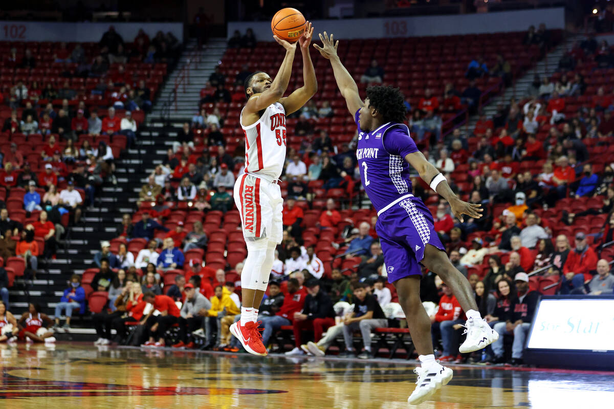 UNLV Rebels guard EJ Harkless (55) takes a shot for three points under pressure from High Point ...