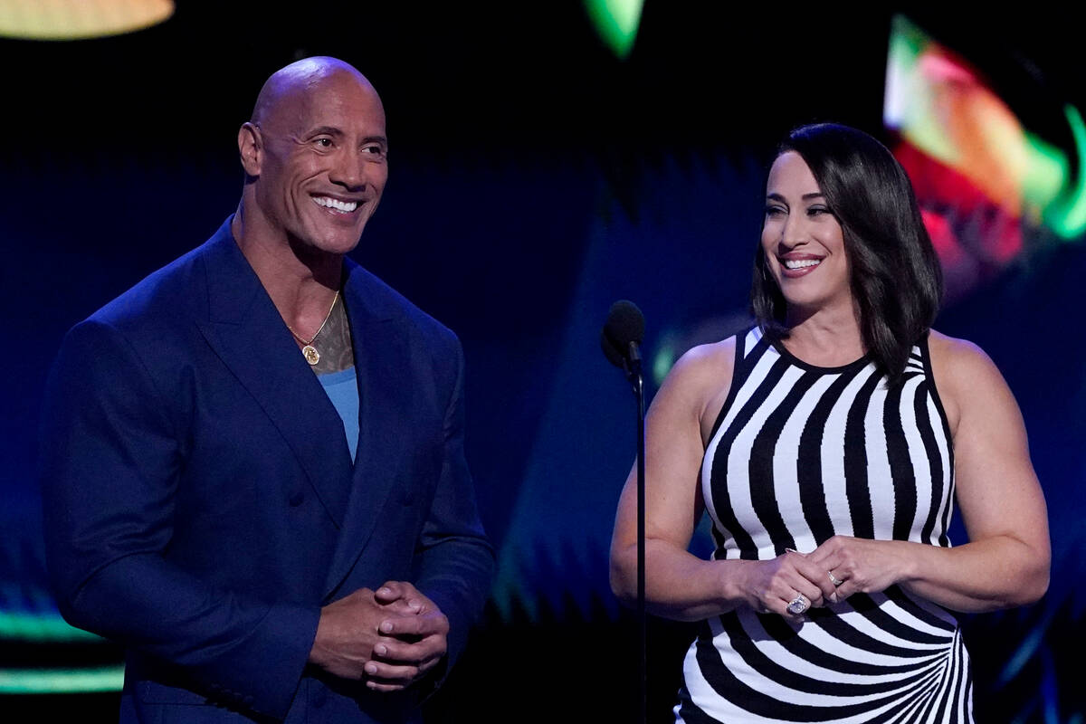 Dwayne "The Rock" Johnson, left, and Dany Garcia speak at the ESPY Awards on Wednesda ...