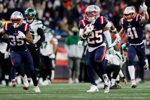 New England Patriots cornerback Marcus Jones (25) runs on this touchdown punt return during the ...