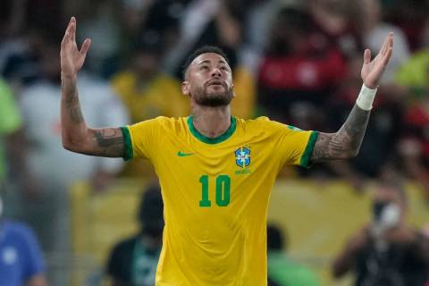 FILE - Brazil's Neymar celebrates after scoring his side's opening goal from the penalty spot d ...