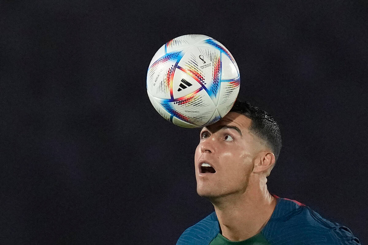 Portugal's Cristiano Ronaldo controls a ball during the Portugal's official training on the eve ...