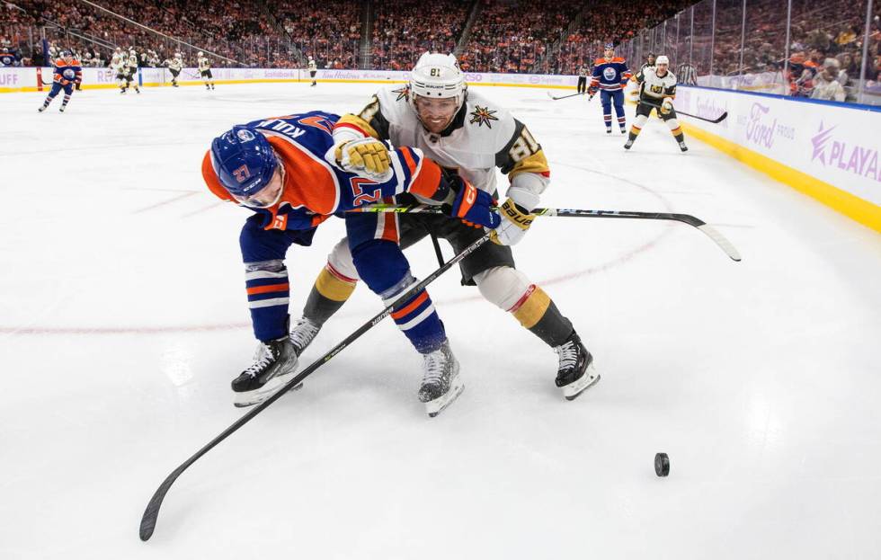 Vegas Golden Knights' Jonathan Marchessault (81) and Edmonton Oilers' Brett Kulak (27) vie for ...